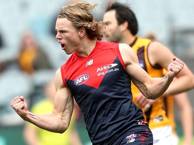 MELBOURNE, AUSTRALIA - AUGUST 06: Jayden Hunt of the Demons celebrates a goal during the 2016 AFL Round 20 match between the Melbourne Demons and the Hawthorn Hawks at the Melbourne Cricket Ground on August 06, 2016 in Melbourne, Australia. (Photo by Justine Walker/AFL Media/Getty Images)