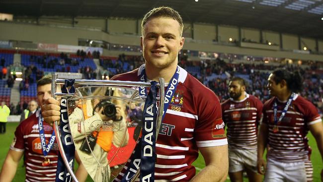 Winners are grinners: Joe Burgess with World Club Challenge trophy.