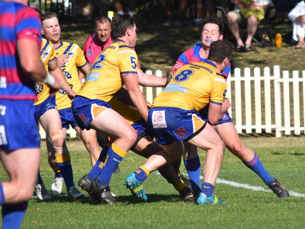 Matthew Stewart is tackled by Cody Kelso (left) and Aidan Kelso. Picture: Sean Teuma