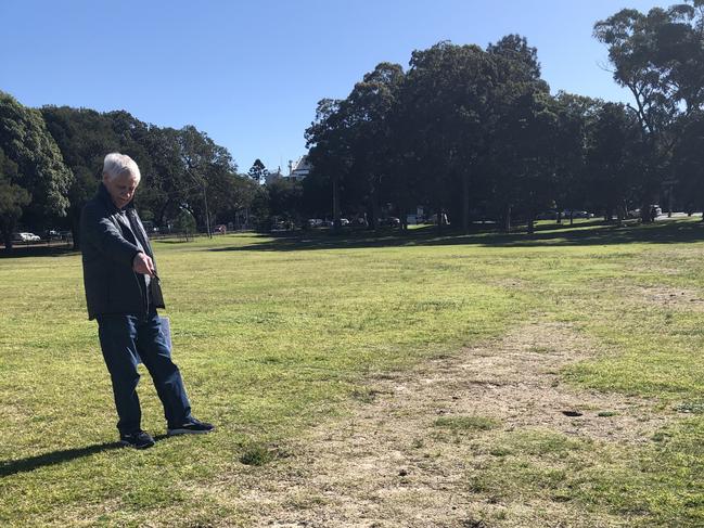 Michael Waterhouse shows the damage to Moore Park East from cars. Photo: Emily Macdonald.