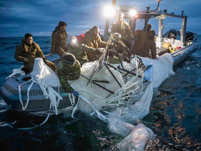 US Navy sailors recover the alleged Chinese spy balloon off the coast of Myrtle Beach, South Carolina, in the Atlantic Ocean on February 5, 2023. Picture: Petty Officer 1st Class Tyler Thompson / US NAVY / AFP