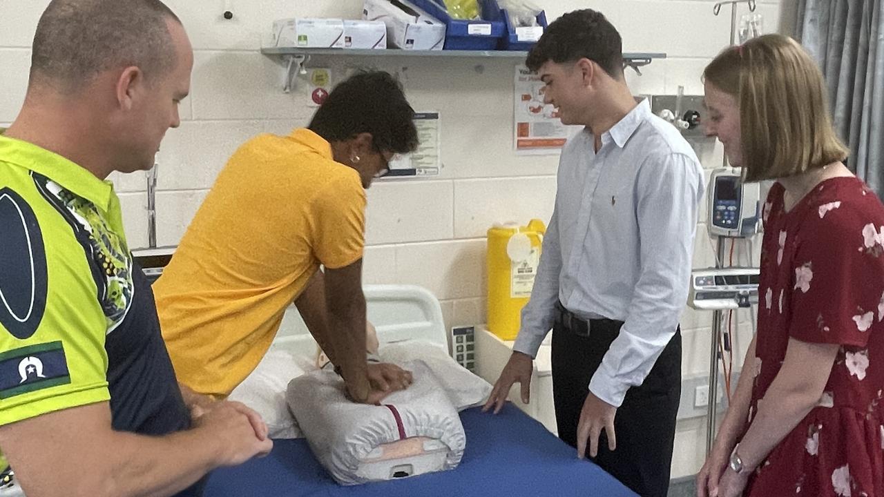 Bundaberg locals Christian Lane-Krebs and Hannah Earl receive training from Varun Lad, president of the CQU Medical Society.