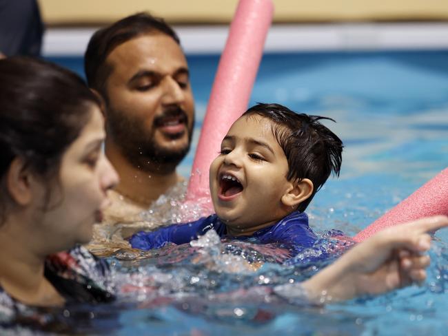 DAILY TELEGRAPH NOVEMBER 15, 2024. Aanav Desai, 2, with his dad Samvit Desai during his swimming lesson at Jump Swim School in Seven Hills, for a story about a drop in kids completing swimming lessons. Picture: Jonathan Ng