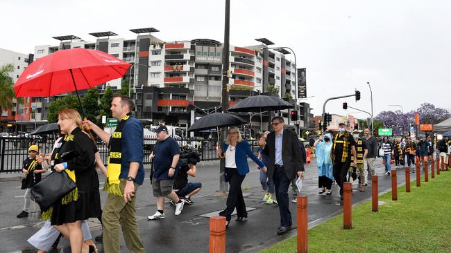 Fans arrive at the Gabba before the 2020 AFL Grand Final match between the Richmond Tigers and the Geelong Cats on Saturday. Picture: Getty