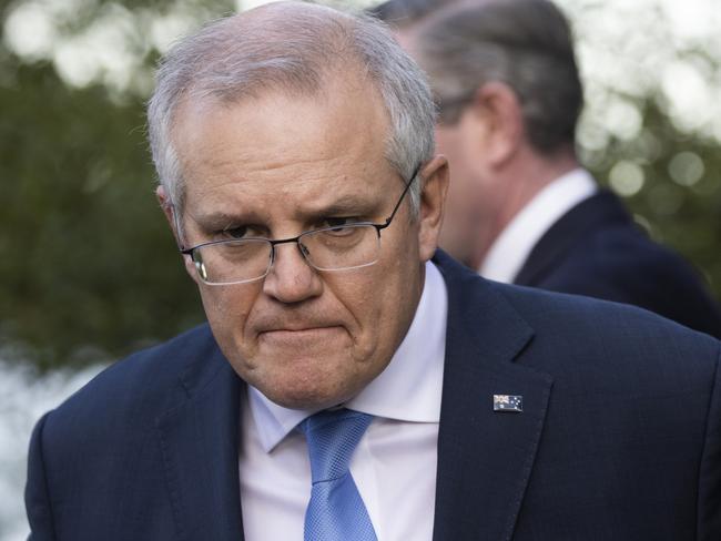 SYDNEY, AUSTRALIA - JULY 13: Australian Prime Minister Scott Morrison looks on during a press conference at Kirribilli House on July 13, 2021 in Sydney, Australia. Prime Minister Scott Morrison and NSW Premier Gladys Berejiklian have announced a financial assistance package to support NSW households and businesses affected by the current COVID-19 lockdown. The combined federal and state support package will see the COVID-19 disaster payment increased to $600 from week four of lockdown, if a person has lost 20 or more hours of work a week, or $375 if a person has lost between eight and 20 hours of work a week. A new business support payment will also be available to entities with an annual turnover between $75,000 and $50 million who can demonstrate a 30 percent decline in turnover. COVID-19 lockdown restrictions are currently in place across Greater Sydney, the Blue Mountains, the Central Coast and Wollongong as NSW continues to record new community COVID-19 cases. All residents are subject to stay-at-home orders and are only permitted to leave their homes for essential reasons, including purchasing essential goods, accessing or providing care or healthcare, work, education and exercise. (Photo by Jenny Evans/Getty Images)