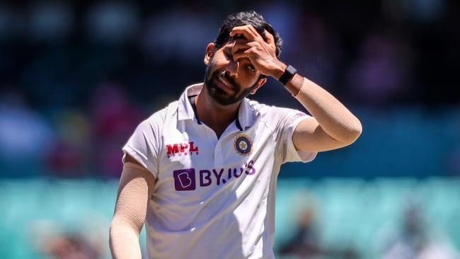 India's Jasprit Bumrah reacts after the catch of Australia's captain Tim Paine was dropped on the fourth day of the third cricket Test match between Australia and India at the Sydney Cricket Ground (SCG) in Sydney on January 10, 2021. (Photo by DAVID GRAY / AFP) / — IMAGE RESTRICTED TO EDITORIAL USE – STRICTLY NO COMMERCIAL USE —