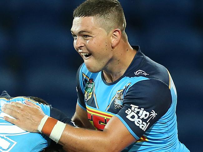 GOLD COAST, AUSTRALIA - MARCH 11: Ashley Taylor (right) of the Titans celebrates the winning try with his team during the round one NRL match between the Gold Coast Titans and the Canberra Raiders at Cbus Super Stadium on March 11, 2018 in Gold Coast, Australia. (Photo by Jono Searle/Getty Images)