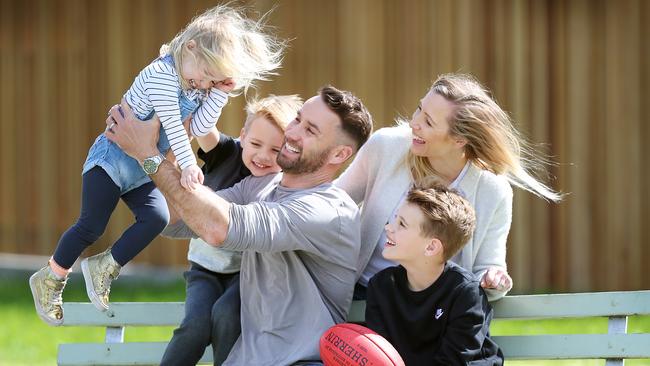 Former Carlton player Andrew Walker with his family Cody, 9, Arli, 5, and Leti, 2, and wife Kylie. He started using a breakthrough new arthritis medicine he says has changed his life. Picture: Alex Coppel