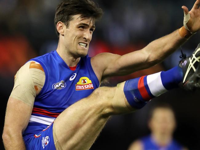 AFL Round 14. Western Bulldogs vs North Melbourne at the Etihad Stadium. Western Bulldogs Tom Campbell kicks at goal   . Pic: Michael Klein