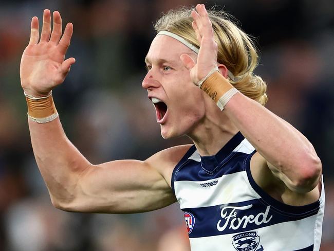 MELBOURNE, AUSTRALIA - JUNE 21: Oliver Dempsey of the Cats celebrates kicking a goal during the round 15 AFL match between Carlton Blues and Geelong Cats at Melbourne Cricket Ground, on June 21, 2024, in Melbourne, Australia. (Photo by Quinn Rooney/Getty Images)