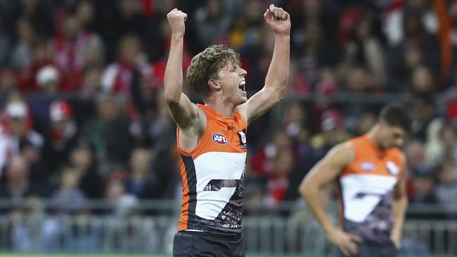 Victory is sweet for GWS Giant Lachie Whitfield. Photo: Ryan Pierse/Getty Images