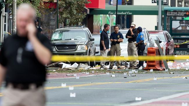 Law enforcement officials at the scene of Saturday night’s explosion in the Chelsea neighbourhood of Manhattan. Picture: Drew Angerer