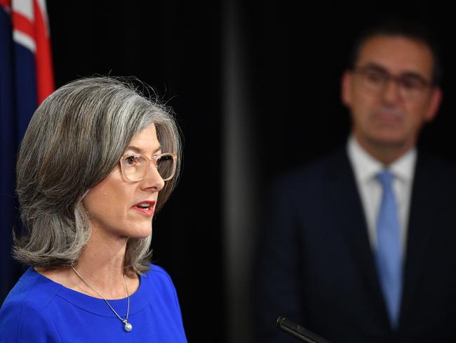 The Premier looks on as SA’s Chief Medical Officer, Dr Nicola Spurrier updates the media on the unfolding crisis in Adelaide. Thursday, April 9, 2020. Photo: AAP /David Mariuz