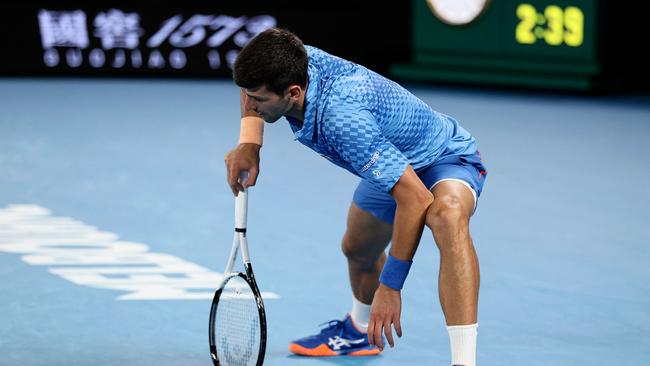 Serbia's Novak Djokovic reacts as he competes against Bulgaria's Grigor Dimitrov