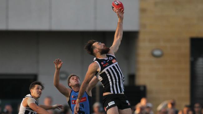 Port Adelaide’s Charlie Dixon attempts to mark late in the last quarter against Sturt at Alberton. Picture: AAP/Dean Martin.