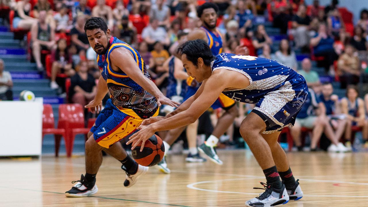 Alex Weetra and Henry Bui scrap for the ball in Darwin Basketball Men's Championship Round 20: Ansett v Tracy Village Jets. Picture: Che Chorley