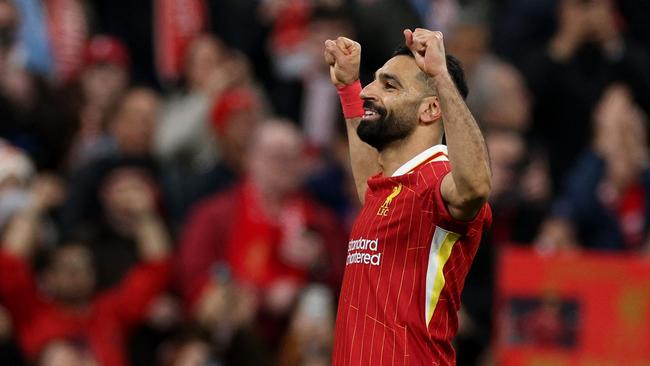 Liverpool's Egyptian striker #11 Mohamed Salah celebrates scoring the team's second goal during the English Premier League football match between Liverpool and Manchester City at Anfield in Liverpool, north west England on December 1, 2024. (Photo by Adrian Dennis / AFP) / RESTRICTED TO EDITORIAL USE. No use with unauthorized audio, video, data, fixture lists, club/league logos or 'live' services. Online in-match use limited to 120 images. An additional 40 images may be used in extra time. No video emulation. Social media in-match use limited to 120 images. An additional 40 images may be used in extra time. No use in betting publications, games or single club/league/player publications. /