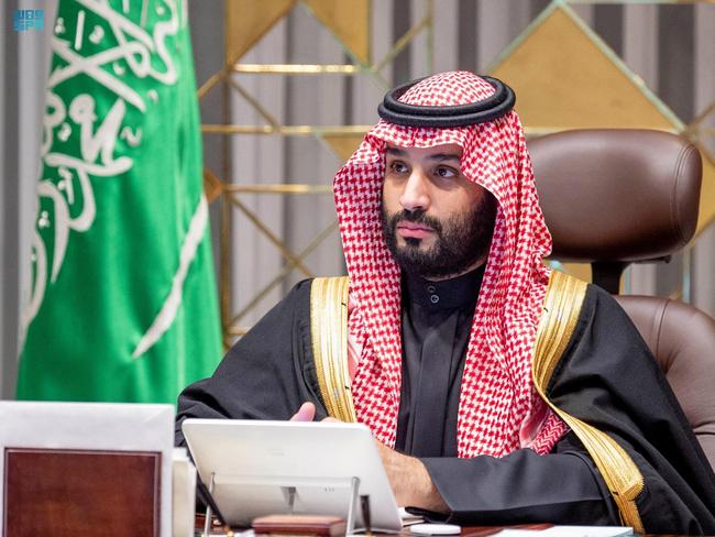 A handout picture provided by the Saudi Press Agency shows Crown Prince Mohammed bin Salman attending the annual shura council meeting, a top advisory body, in the capital Riyadh on December 30, 2021. - During a televised speech Saudi Arabia's King Salman urged arch-rival Iran today to end its "negative behaviour" in the region, after Riyadh accused Tehran of aiding Yemeni rebels in launching deadly attacks on his country. (Photo by SPA / AFP) / === RESTRICTED TO EDITORIAL USE - MANDATORY CREDIT "AFP PHOTO / HO / SPA" - NO MARKETING NO ADVERTISING CAMPAIGNS - DISTRIBUTED AS A SERVICE TO CLIENTS ===