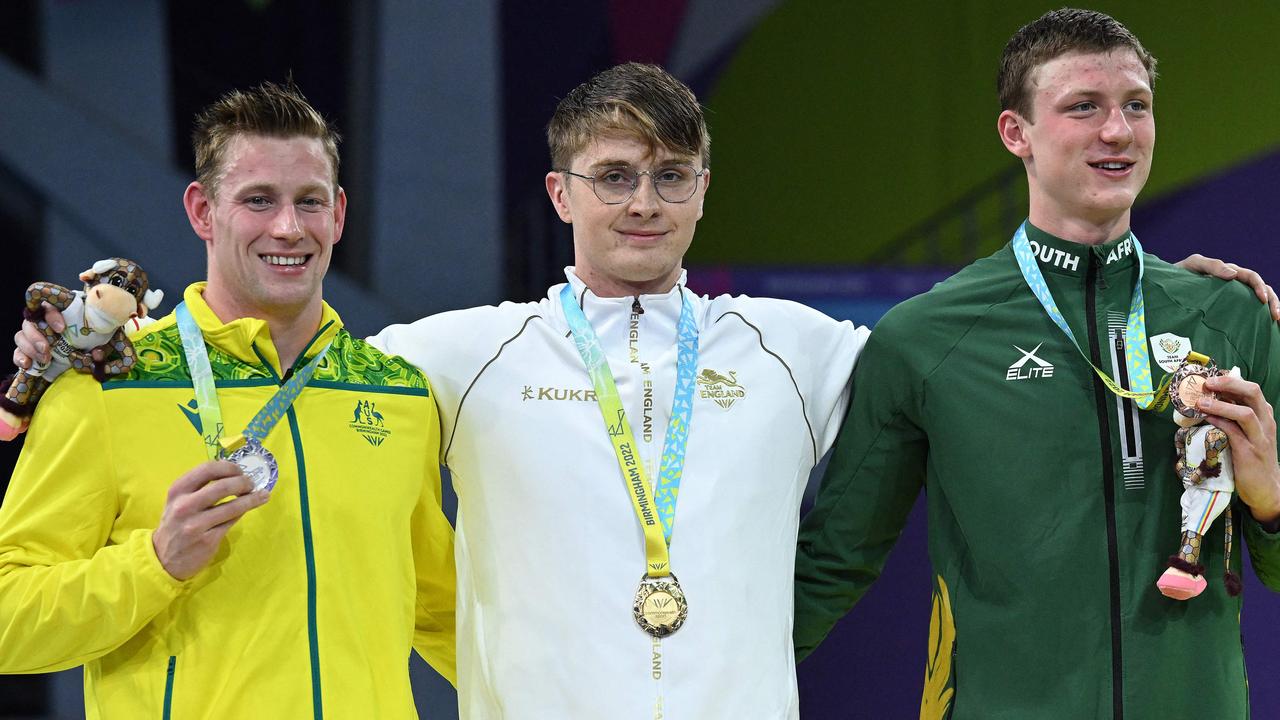 Bradley Woodward with fellow medallists Brodie Williams and Pieter Coetze. Picture: Andy Buchanan / AFP