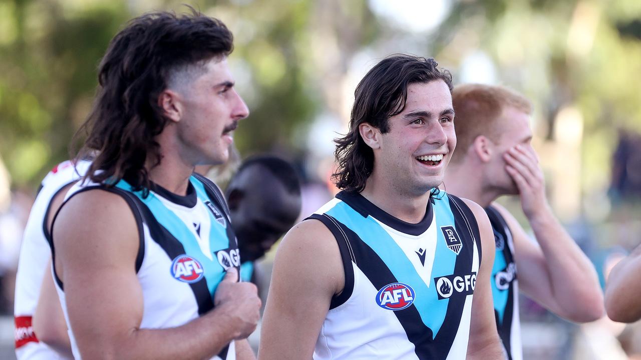 Josh Sinn of the Power all smiles with Lachie Jones.