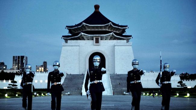 Taiwanese honour guards march in front of the Chiang Kai-shek Memorial Hall in Taipei. Picture: AFP