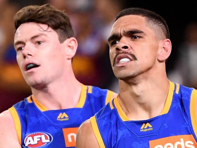 Dylan Grimes of the Tigers  is assisted up by Charles Cameron of the Lions during the Second Qualifying Final between the Brisbane Lions and the Richmond Tigers during Week 1 of the AFL Finals Series at the Gabba in Brisbane, Saturday, September 7, 2019. (AAP Image/Dave Hunt) NO ARCHIVING, EDITORIAL USE ONLY