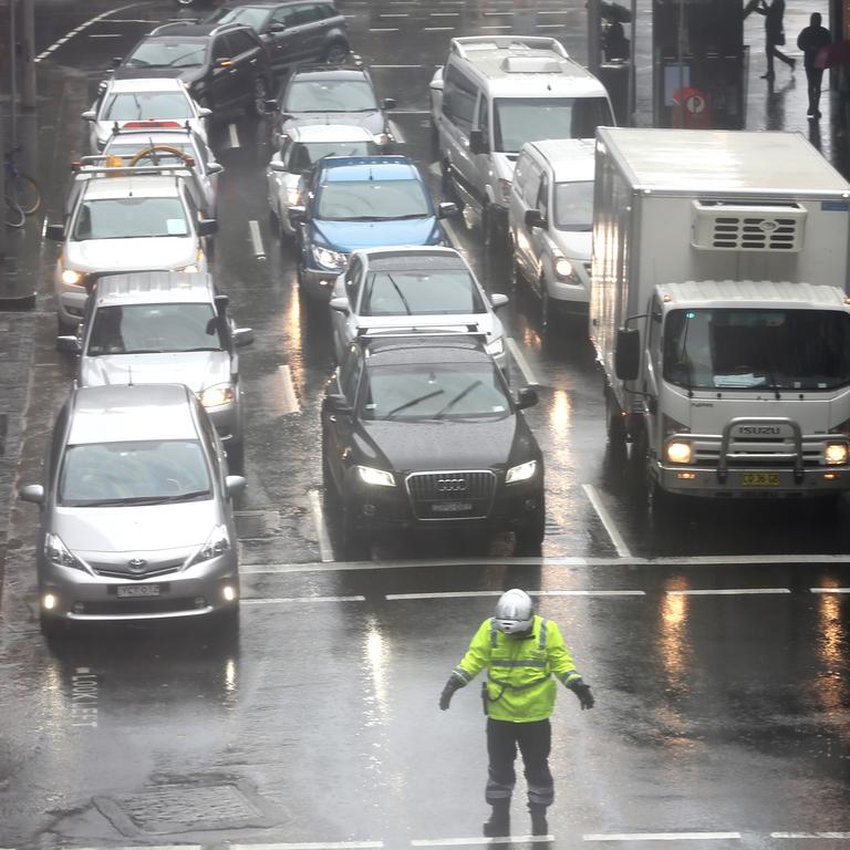 As The low hits Sydney ,commuters stuggle with the conditions .picture John Grainger