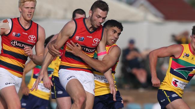 Eagles small forward Tyson Stengle lays a strong tackle against his former club Adelaide in the SANFL clash at Woodville Oval on Saturday. Picture: Dean Martin