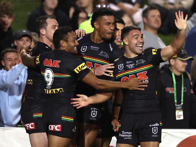 PENRITH, AUSTRALIA - MARCH 10:  Stephen Crichton of the Panthers celebrates with team mates after scoring a try, which was later disallowed by the video bunker during the round one NRL match between the Penrith Panthers and the Manly Sea Eagles at BlueBet Stadium on March 10, 2022, in Penrith, Australia. (Photo by Cameron Spencer/Getty Images)