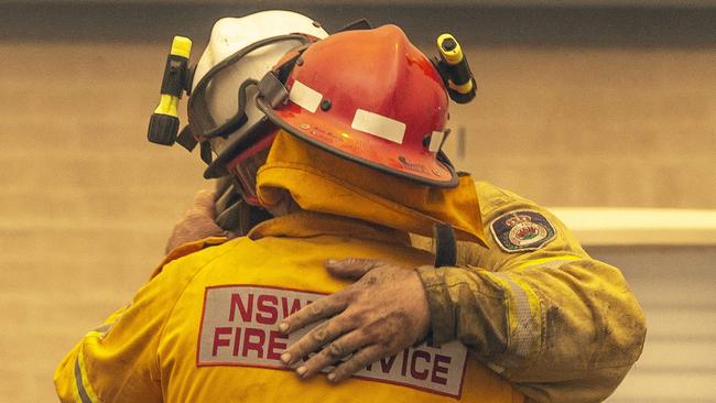 Dave Sharpe thanks his colleague after they save his property. Picture: Gary Ramage