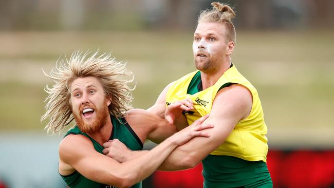 Dyson Heppell and Jake Stringer tangle at training. Picture: Getty