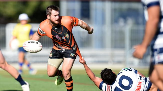 Crushers' Mitchell Seri held back by Brothers' Mitch Hall. Picture: Alix Sweeney