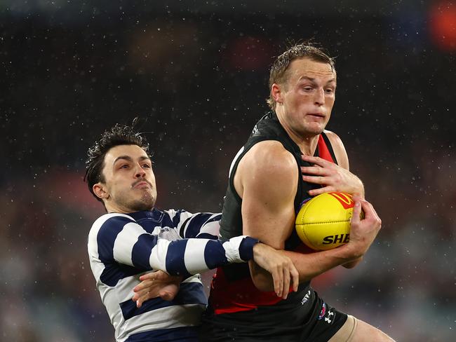 Mason Redman of the Bombers takes a mark during the round 16 AFL match between Geelong Cats and Essendon Bombers at Melbourne Cricket Ground on June 29, 2024 in Melbourne, Australia. (Photo by Graham Denholm/Getty Images)