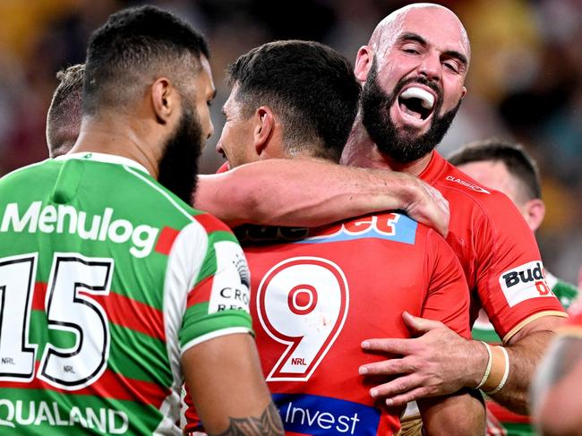 BRISBANE, AUSTRALIA - APRIL 13: Jeremy Marshall-King of the Dolphins is congratulated by team mate Mark Nicholls of the Dolphins after scoring a try during the round seven NRL match between the Dolphins and South Sydney Rabbitohs at Suncorp Stadium on April 13, 2023 in Brisbane, Australia. (Photo by Bradley Kanaris/Getty Images)