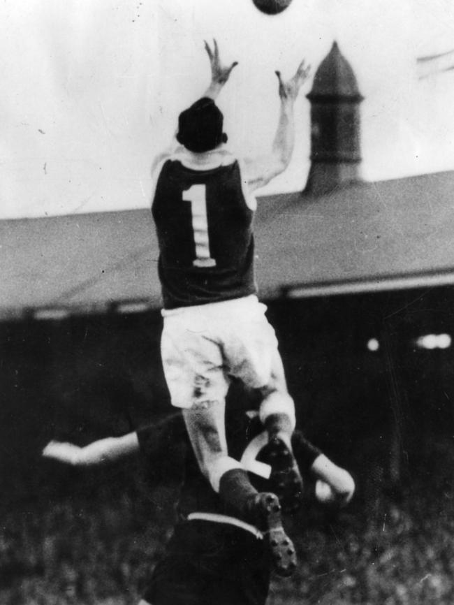 North Adelaide’s Ian McKay takes a spectacular a mark over Norwood’s Pat Hall in the 1952 SANFL Grand Final at Adelaide Oval. Picture: Bill Teubner