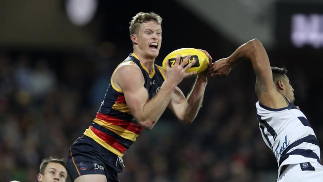 Adelaide’s Alex Keath marks over Geelong’s Tim Kelly. Picture: Sarah Reed