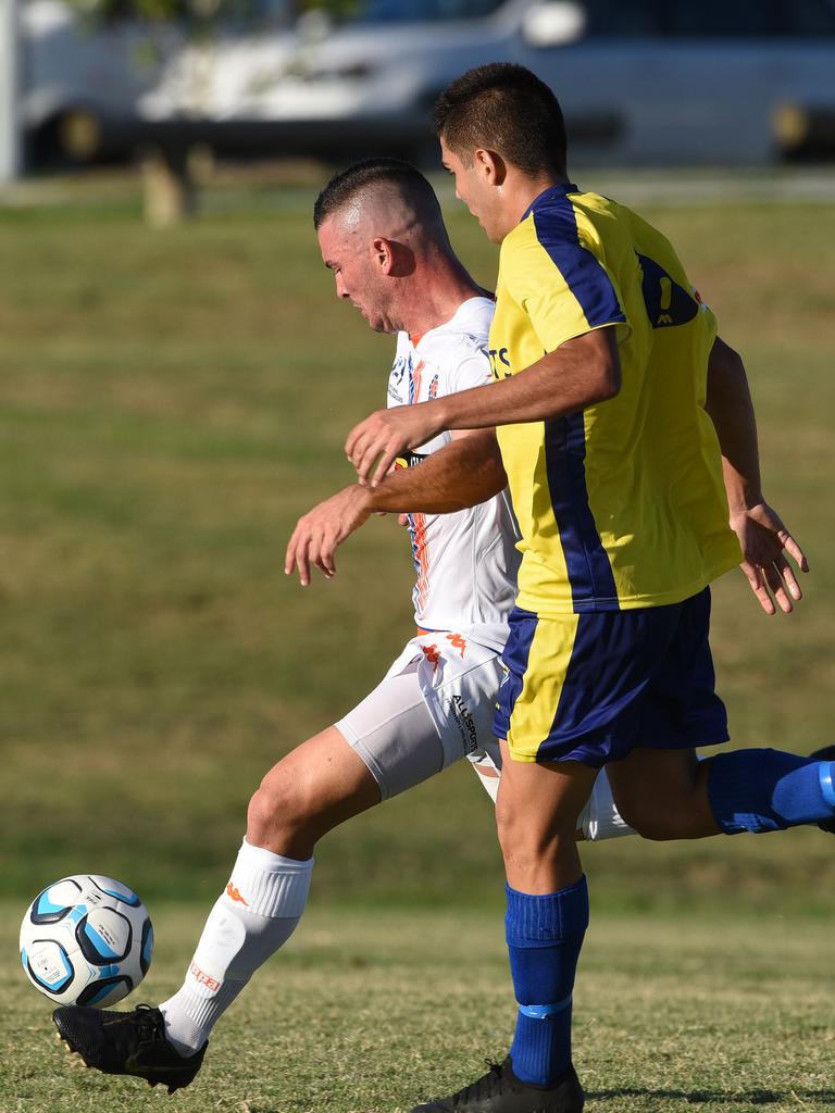 Lions FC Andy Thompson (left) and United's Junya Yabe. Picture: Steve Holland