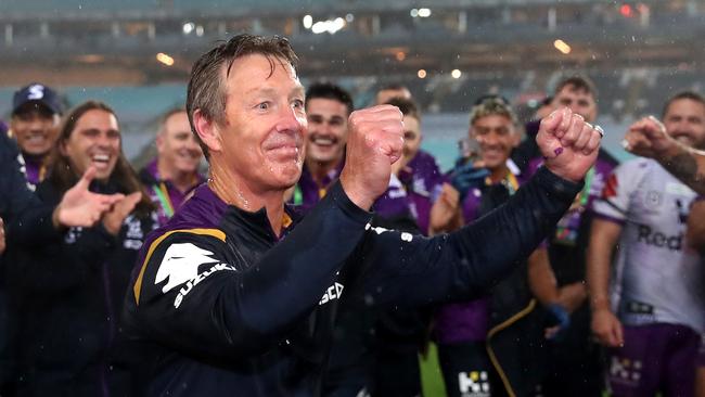 Storm coach Craig Bellamy has Gatorade poured over him after winning the 2020 NRL grand final.