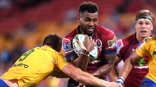 Queensland’s Samu Kerevi tries to bust through the Bulls defence on Saturday night
