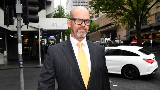 Former Victoria Police Chief Commissioner Simon Overland arrives to the Royal Commission. Picture: AAP Image/James Ross