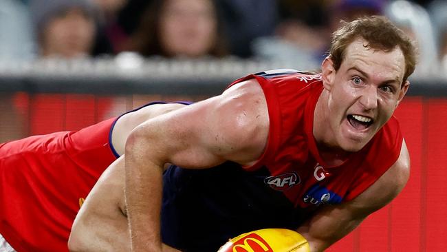 MELBOURNE, AUSTRALIA - APRIL 11: Harrison Petty of the Demons is tackled during the 2024 AFL Round 05 match between the Melbourne Demons and the Brisbane Lions at the Melbourne Cricket Ground on April 11, 2024 in Melbourne, Australia. (Photo by Michael Willson/AFL Photos via Getty Images)