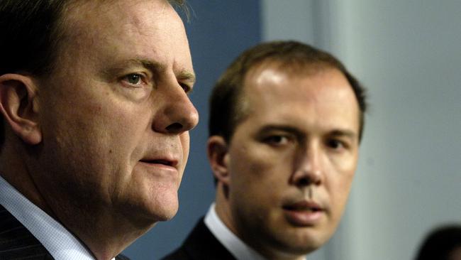 Then-treasurer Peter Costello (left) and then-Assistant Treasurer Peter Dutton speak to the media during a press conference in Canberra in 2006.