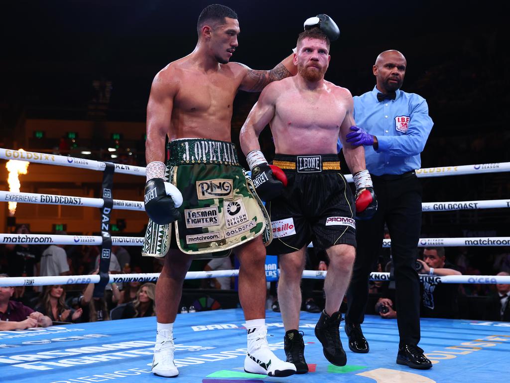 Opetaia comforts Squeo after the fight. Picture: Chris Hyde/Getty Images