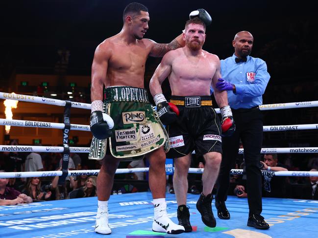 Opetaia comforts Squeo after the fight. Picture: Chris Hyde/Getty Images