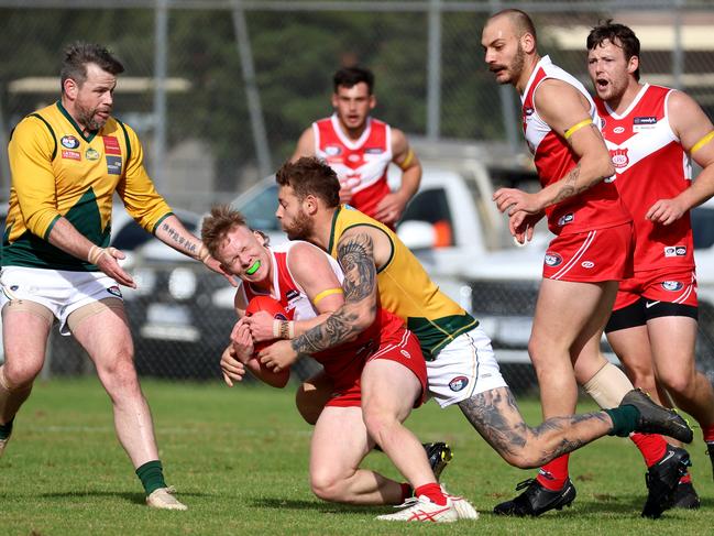 NFNL: Jai Bennett of Lalor can’t escape the tackle. Picture: Hamish Blair