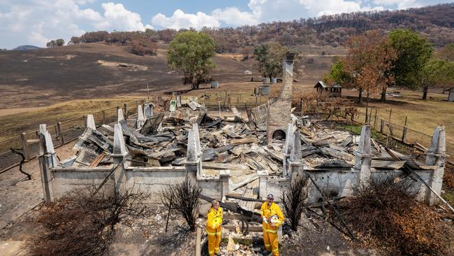 The Kuckas on their fire-ravaged property. Picture: Simon Dallinger