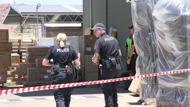 Northern Territory police at the Harvey Norman warehouse on Smith St, Alice Springs, on Tuesday February 4. Picture: Gera Kazakov