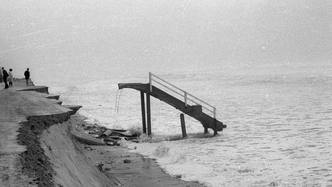 Beach stairs exposed and damaged by severe erosion, Mermaid Beach, Queensland, 1967. Source: Gold Coast Libraries Local Studies Collection.