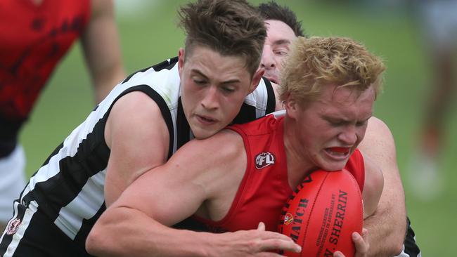 Reynella's Hayden Lorrain giving close attention to Flagstaff Hill's Casey Davies earlier this season. Picture: Dean Martin