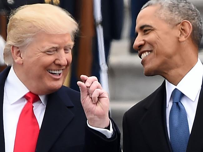 US President Donald Trump and former President Barack Obama talk on the East steps of the US Capitol after inauguration ceremonies on January 20, 2017, in Washington, DC. / AFP PHOTO / Robyn BECK